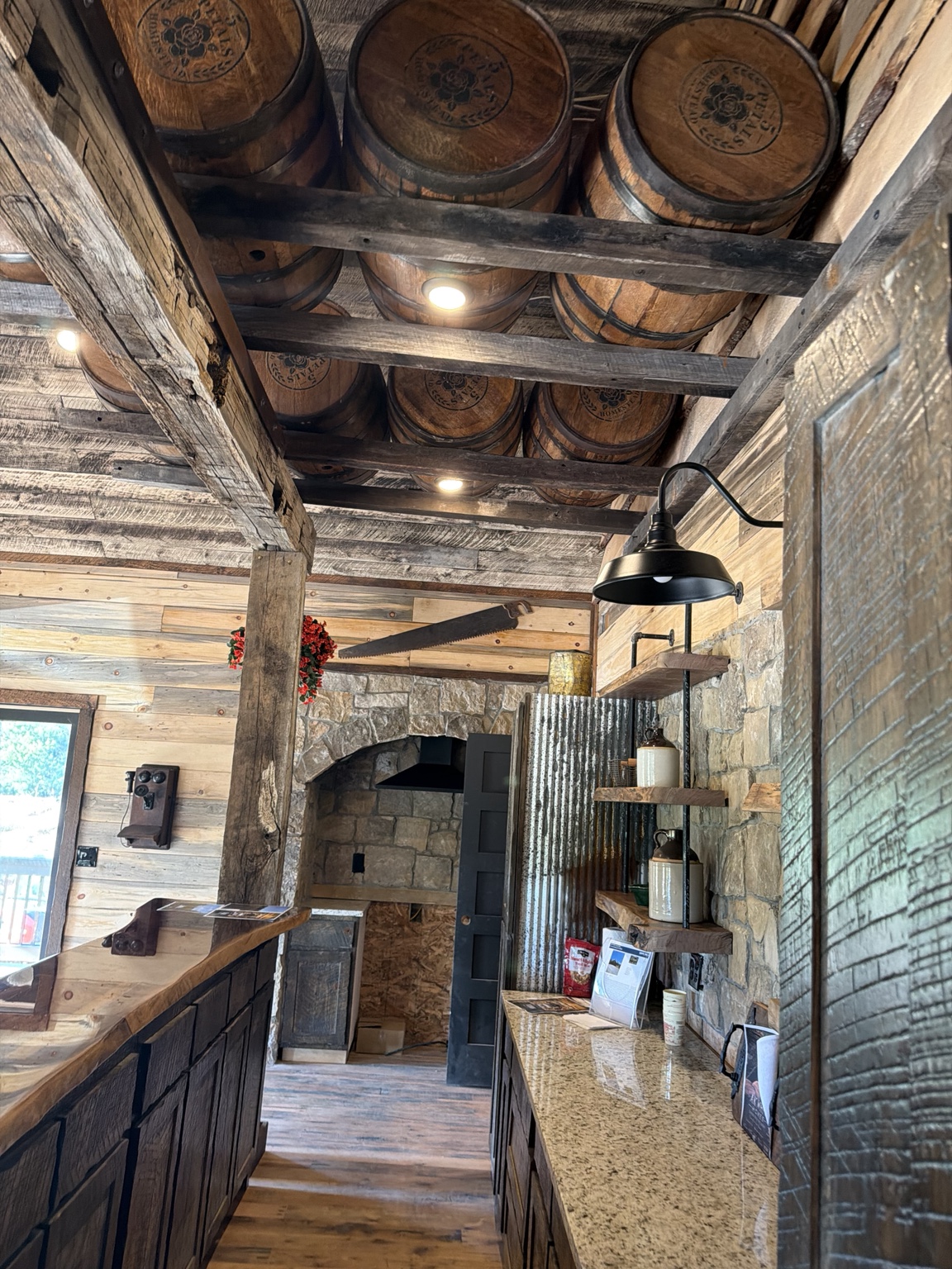 Barrel ceiling with hand-hewn timbers and stone shelving