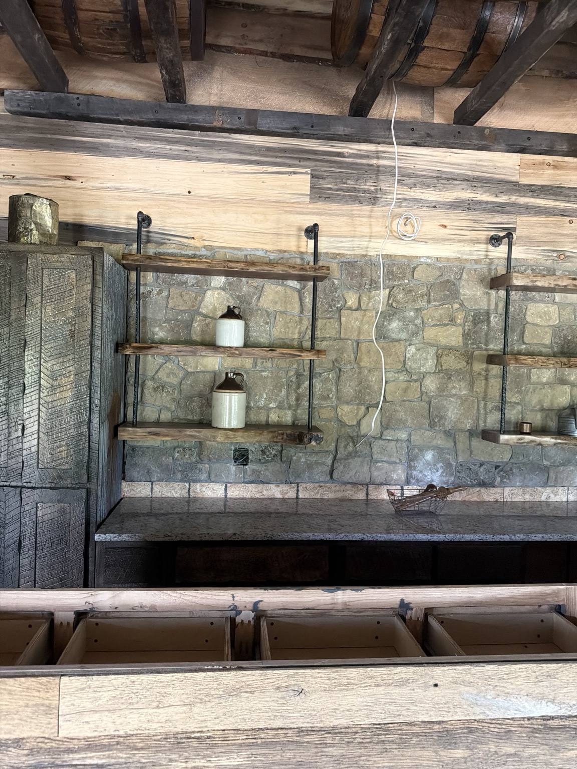 Live-edge shelves during kitchen construction